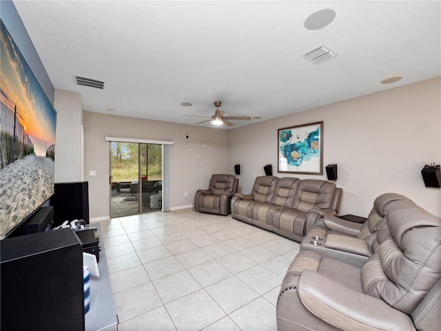 living room with ceiling fan and light tile patterned flooring