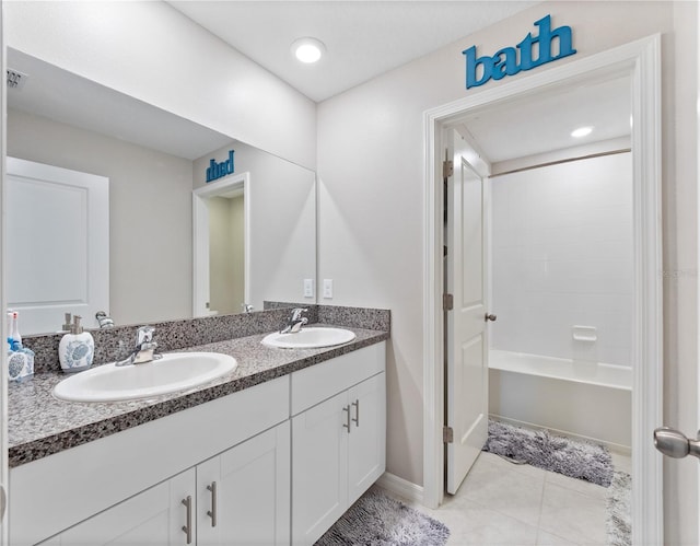 bathroom with shower / washtub combination, tile patterned floors, and vanity