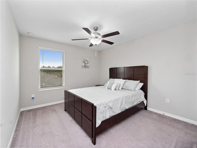 bedroom featuring ceiling fan and light colored carpet