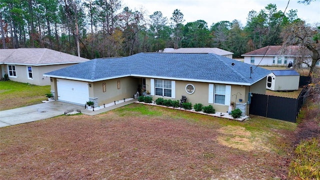 ranch-style house featuring a garage and a front yard