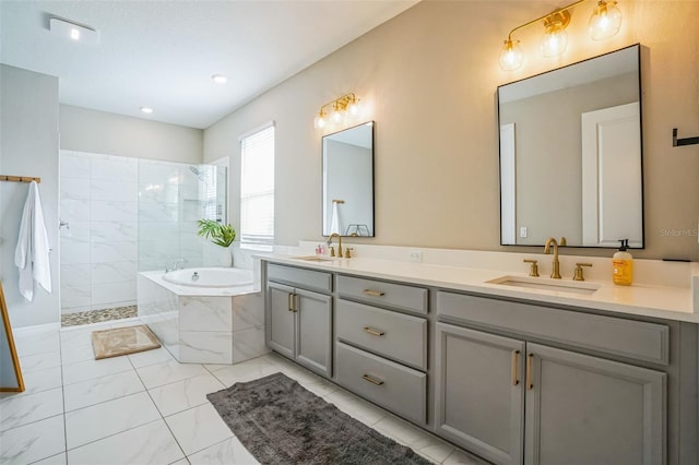 bathroom featuring vanity and shower with separate bathtub