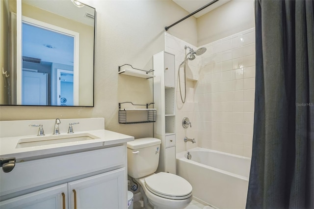 full bathroom with vanity, shower / tub combo with curtain, and toilet