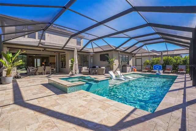 view of swimming pool featuring an in ground hot tub, a patio area, and glass enclosure