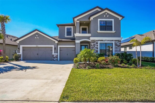 view of front of house featuring a garage and a front yard