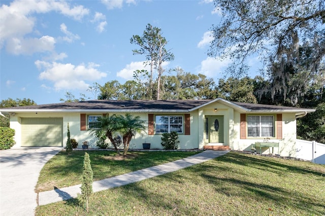 single story home with a garage and a front yard