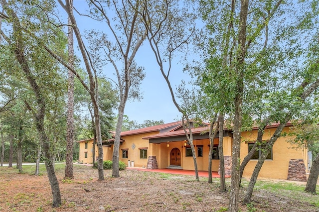 rear view of property with a patio area