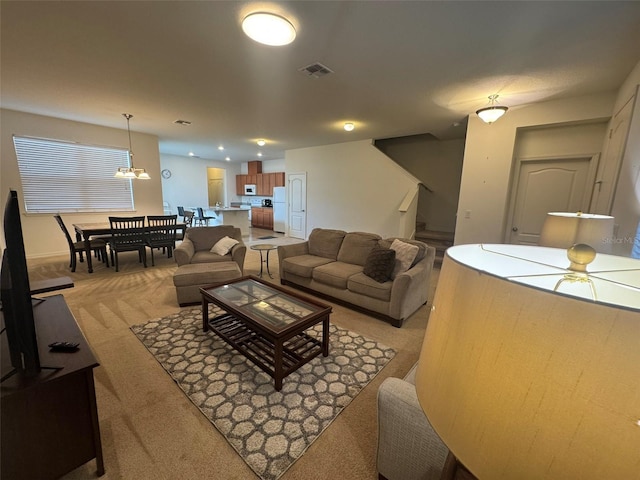 living room with light colored carpet