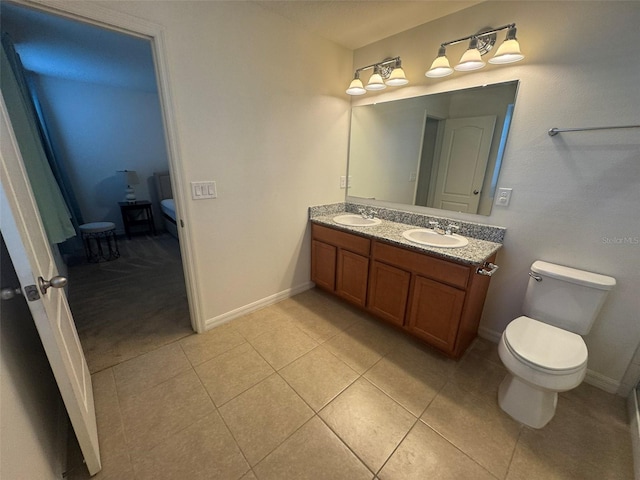 bathroom with vanity, tile patterned floors, and toilet