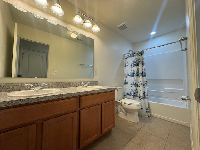 full bathroom with vanity, tile patterned flooring, toilet, and shower / bath combo with shower curtain