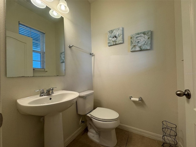 bathroom featuring tile patterned floors and toilet