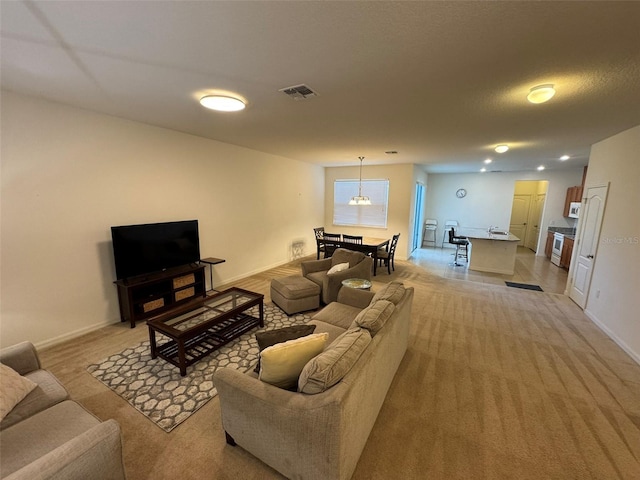 living room featuring light carpet