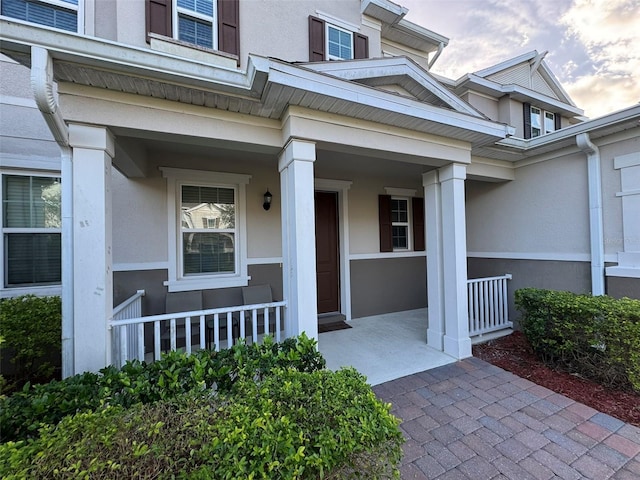 property entrance featuring covered porch