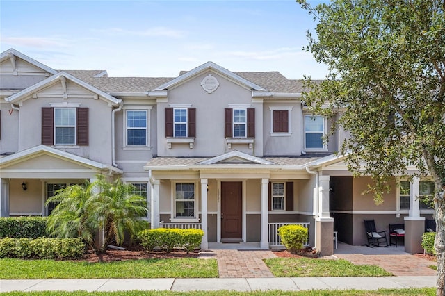 13731 Bravante Aly, Windermere, FL 34786 - multi unit property featuring stucco siding, covered porch, and a shingled roof