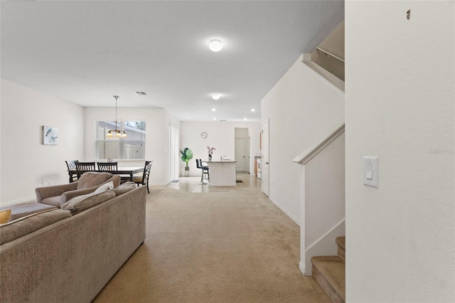 13731 Bravante Aly, Windermere, FL 34786 - living area with light colored carpet, stairs, and baseboards