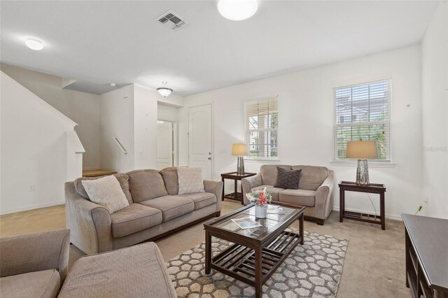 13731 Bravante Aly, Windermere, FL 34786 - living room with light carpet, plenty of natural light, stairway, and baseboards