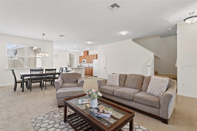 13731 Bravante Aly, Windermere, FL 34786 - living area with light colored carpet, baseboards, a chandelier, and stairway