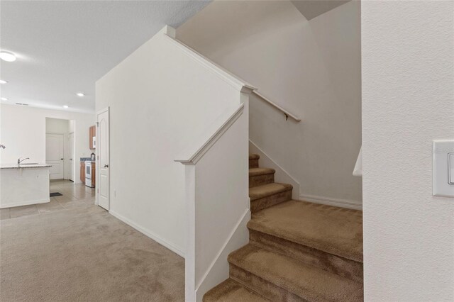 13731 Bravante Aly, Windermere, FL 34786 - staircase with carpet flooring, recessed lighting, and baseboards