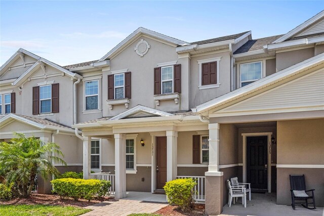 13731 Bravante Aly, Windermere, FL 34786 - townhome / multi-family property featuring a porch and stucco siding