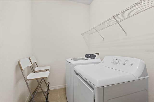 13731 Bravante Aly, Windermere, FL 34786 - laundry area with washing machine and dryer, baseboards, and light tile patterned floors