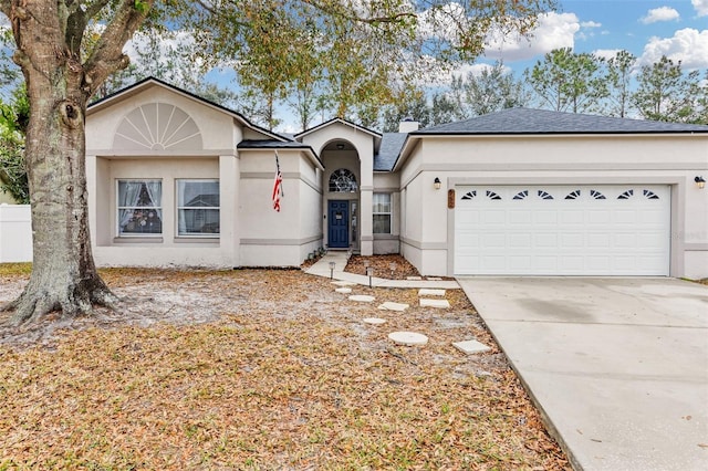 single story home featuring a garage