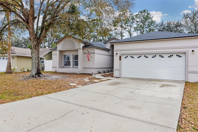 single story home featuring a garage