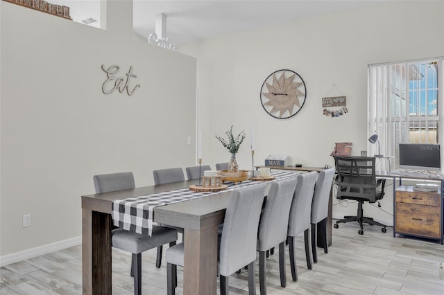 dining space with light hardwood / wood-style floors