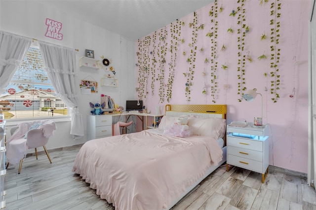 bedroom with light wood-type flooring