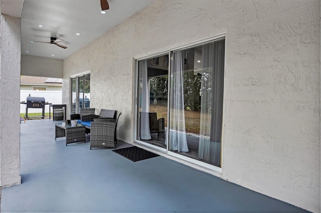 view of patio / terrace with ceiling fan and a grill