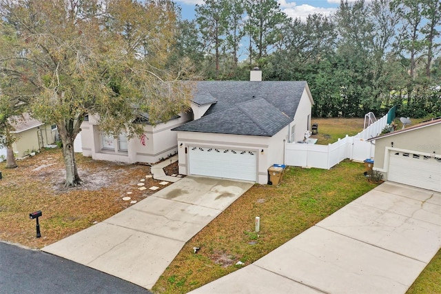 view of front of house featuring a front yard and a garage