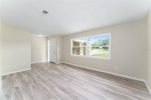 unfurnished room featuring light hardwood / wood-style flooring