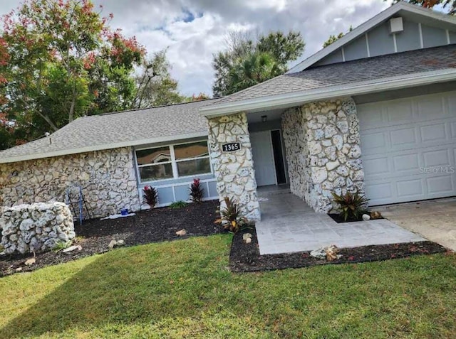 ranch-style house with a front lawn and a garage