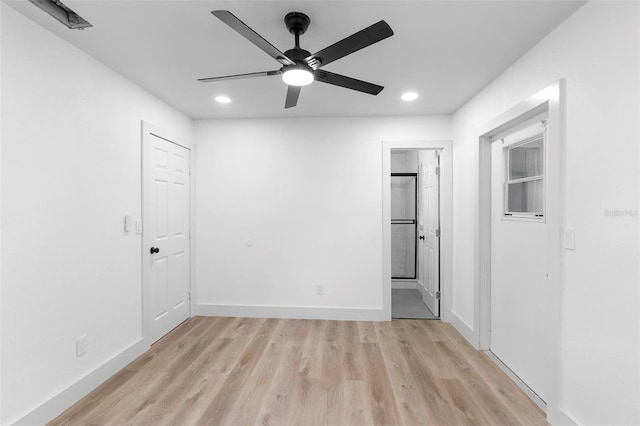 unfurnished room featuring ceiling fan and light hardwood / wood-style floors