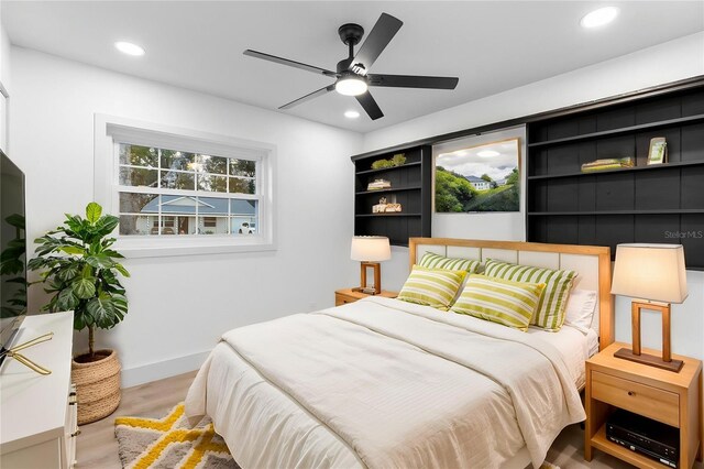 bedroom with baseboards, a ceiling fan, wood finished floors, and recessed lighting