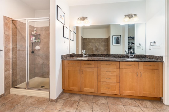 bathroom featuring vanity and a shower with shower door