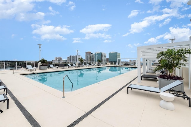 view of swimming pool with a patio