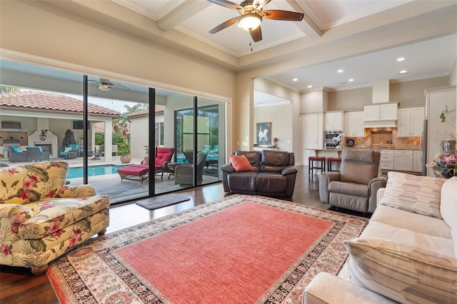 living room with ceiling fan, wood-type flooring, crown molding, and beamed ceiling