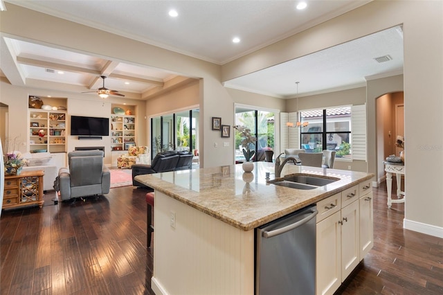 kitchen with dishwasher, a center island with sink, beam ceiling, coffered ceiling, and light stone counters