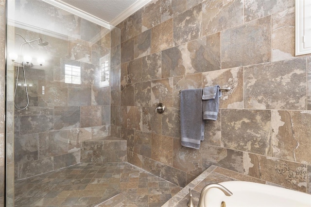 bathroom with a textured ceiling, ornamental molding, and shower with separate bathtub