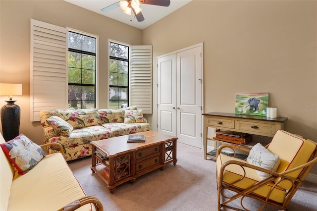 living room featuring ceiling fan and carpet flooring