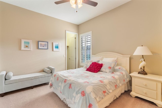 bedroom with ceiling fan and light carpet