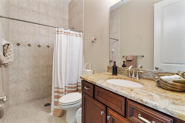 bathroom featuring toilet, vanity, tile patterned floors, and curtained shower