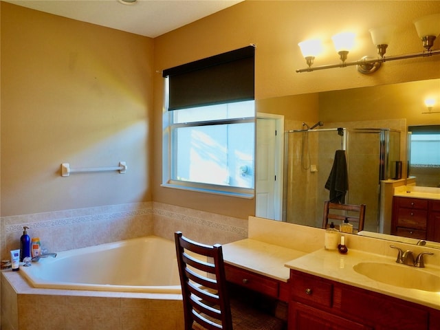 bathroom with vanity and separate shower and tub