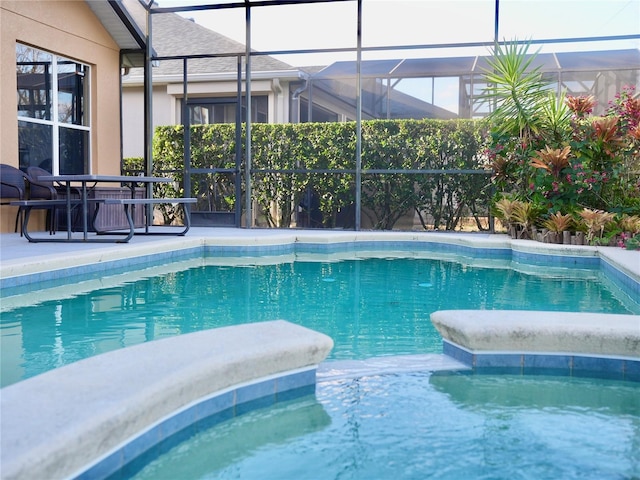 view of pool featuring a lanai