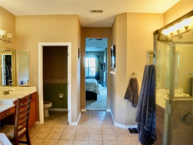 bathroom with vanity, an enclosed shower, tile patterned floors, and toilet