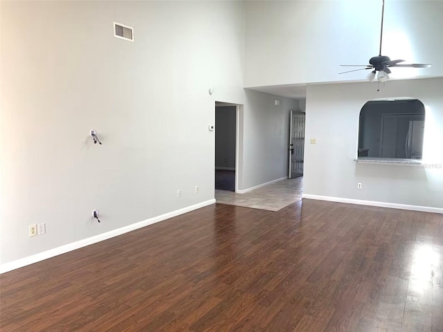 unfurnished living room with ceiling fan and hardwood / wood-style floors