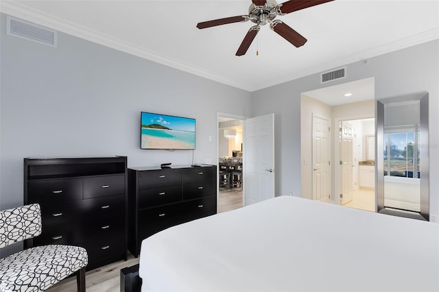 bedroom featuring ceiling fan, ornamental molding, connected bathroom, and light hardwood / wood-style flooring