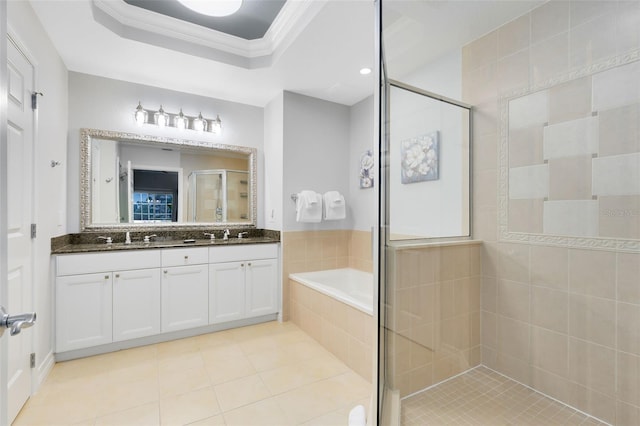 bathroom featuring crown molding, vanity, a tray ceiling, plus walk in shower, and tile patterned flooring