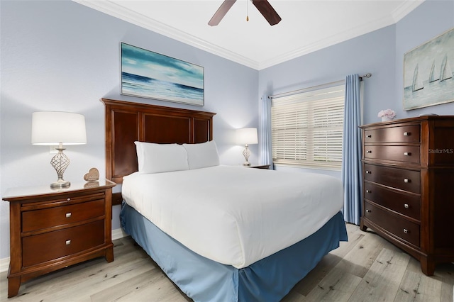 bedroom featuring ornamental molding, ceiling fan, and light wood-type flooring