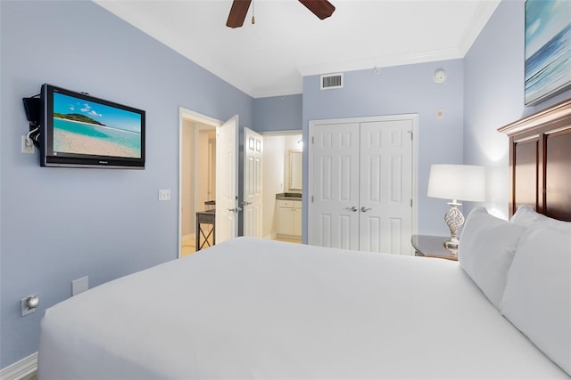 bedroom with crown molding, a closet, and ceiling fan