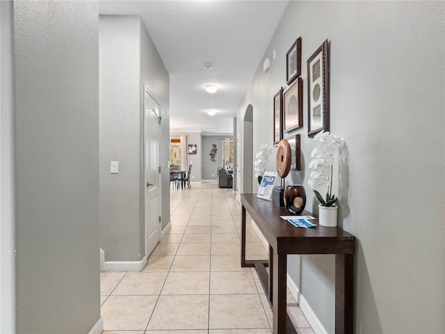 hallway with light tile patterned floors